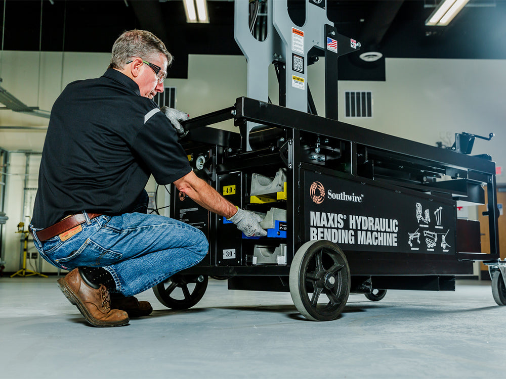 Trademan working on southwire maxis hydraulic bending machine