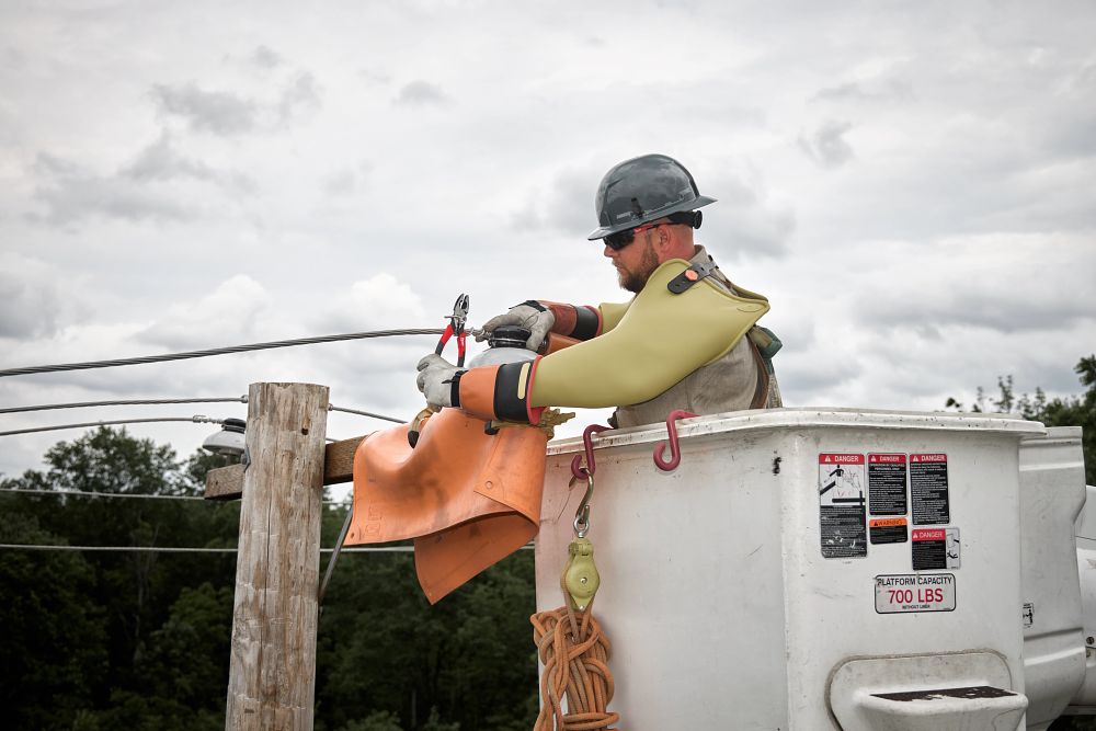 Lineman working with pliers