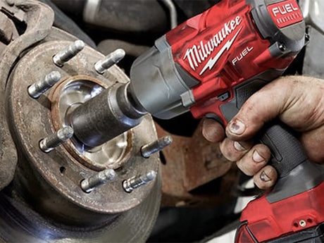 Mechanic using Impact Wrench 