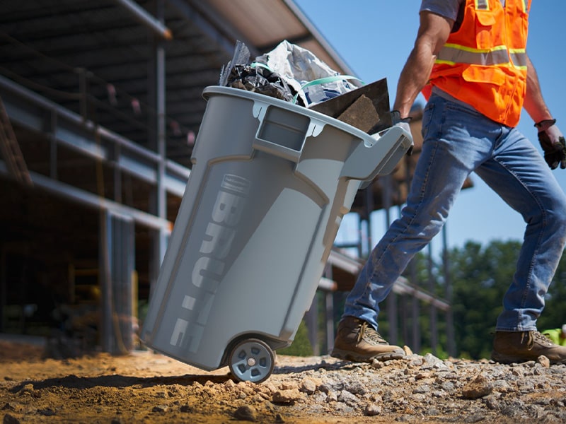 Man using Rubbermaid Commercial Series Trash Can